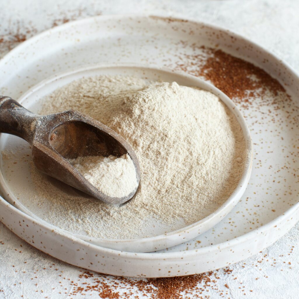 Teff flour in a plate with a spoon