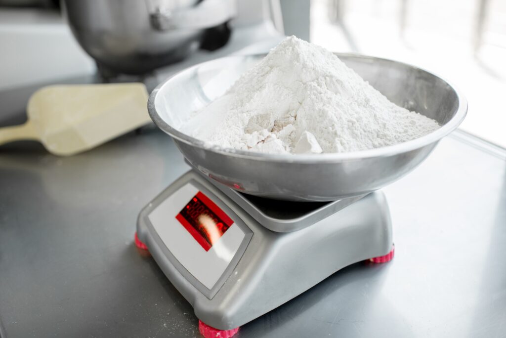 Weighing flour for baking at the manufacturing
